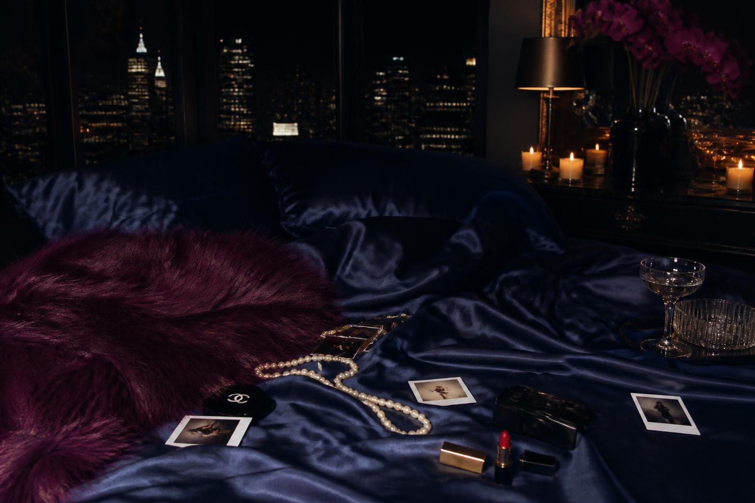 Night skyline through steel windows of a Manhattan penthouse